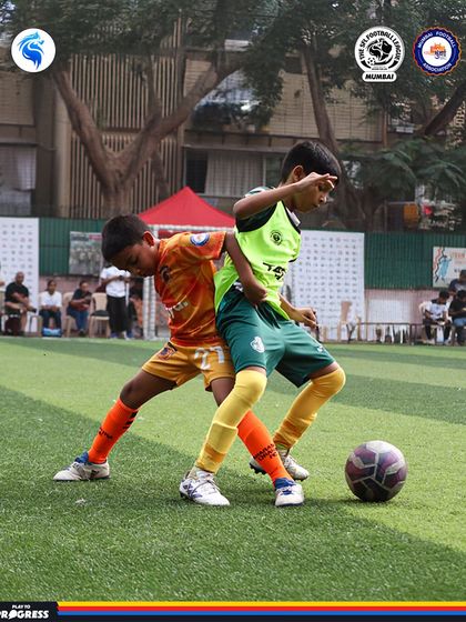 Two players jostle for position. Physicality and strength are important parts of a player's development.
