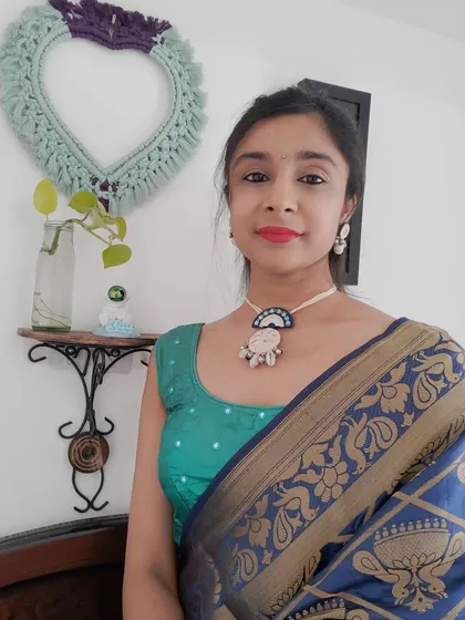 Modeling two of my favorite handmade necklace sets. The first is a bold orange mirror work set for a garba night, and the second is a more subtle blue and white mirror set that pairs beautifully with a silk saree.