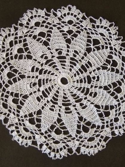 A 15-inch flower crochet doily, perfect for table decor.