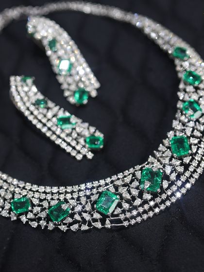 A modern take on a classic design, this emerald and diamond necklace is perfect for the contemporary woman. The clean lines of the emerald-cut stones make it both elegant and edgy.