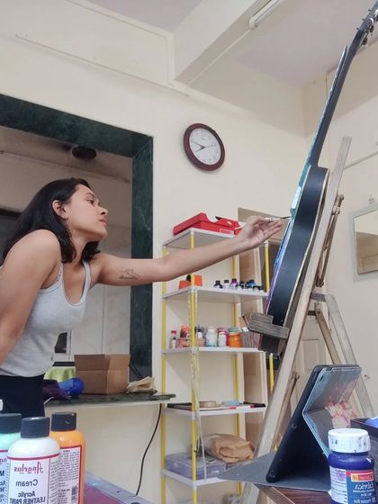 Another angle of me painting the custom guitar. It's all about finding the right position to get those clean lines.