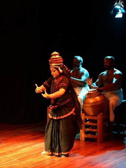 A dancer performs in the traditional costume of Nangiar Koothu.