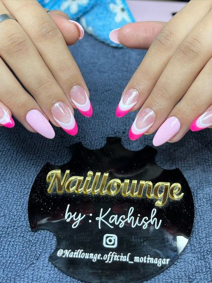 A fun and bright pink French manicure with a solid pink accent nail for a pop of color.