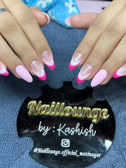 A fun and bright pink French manicure with a solid pink accent nail for a pop of color.