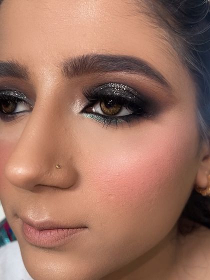 A shot taken after demonstrating a black glitter smokey eye for my students. This is a great look for learning blending and glitter application.