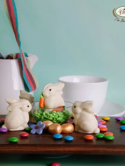 A playful scene with our white chocolate Easter bunnies and the 'Bunny in a Globe' dessert.