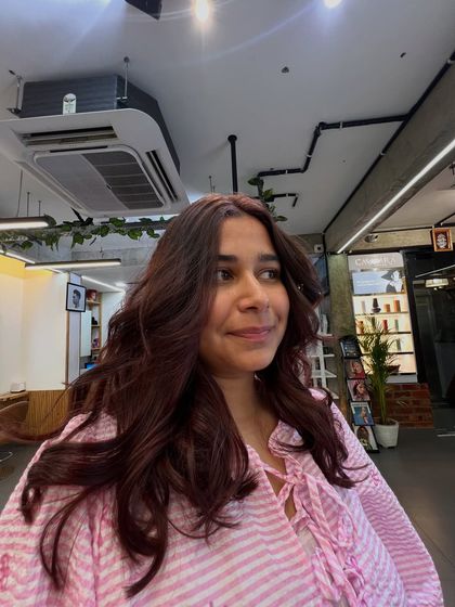 A happy client showing off her new color. Seeing my clients smile is the most rewarding part of my job.