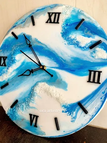 A minimalist take on the ocean theme, this clock uses white resin to create the look of sea foam against a deep blue background.