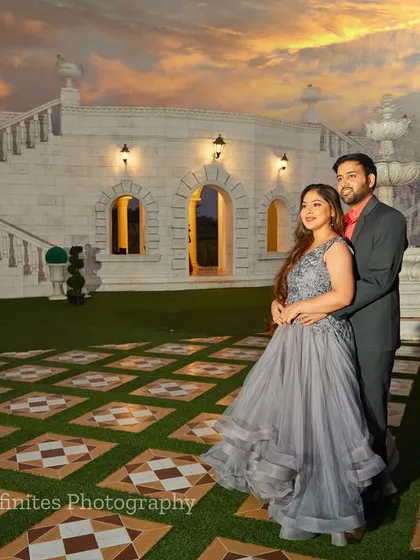 A beautiful sunset shot at our white villa set. The warm evening light adds a romantic glow to this elegant couple's portrait.