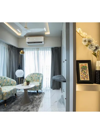 In the Duplex Project, we designed this formal seating area within the master suite. The floral armchairs provide a charming spot for morning coffee or quiet reading, separate from the main sleeping area.
