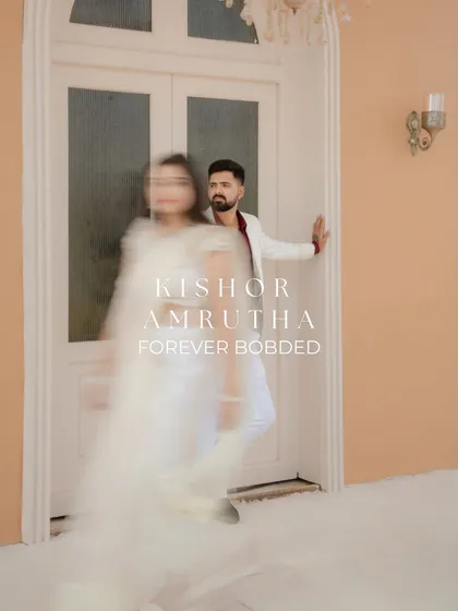 An artistic shot using a slow shutter speed to create a motion blur effect. This technique adds a dreamy, ethereal quality to the photo, with the groom in sharp focus and the bride appearing as a graceful vision.