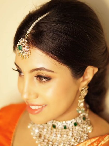 Priyanka was absolutely glowing for her baby shower. This beautiful portrait captures the soft, peachy tones and radiant finish of her makeup, perfect for celebrating her journey to motherhood.