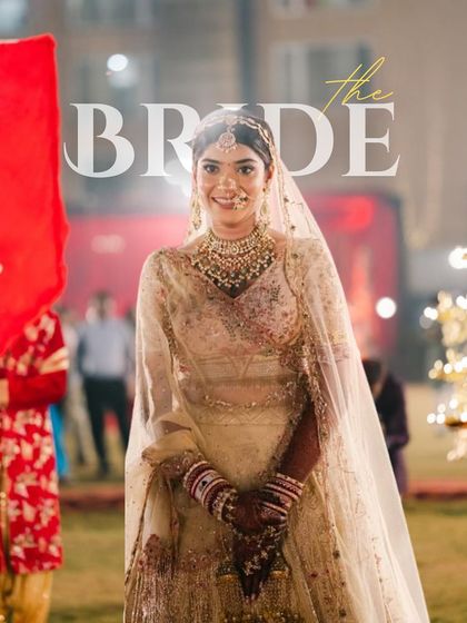 A stunning portrait of the bride, capturing her radiant smile and the intricate details of her wedding look.