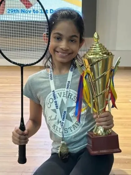 Our U-11 Girls Singles champion, Antara Subramaniam, holding her well-deserved trophy at the ISSO tournament.