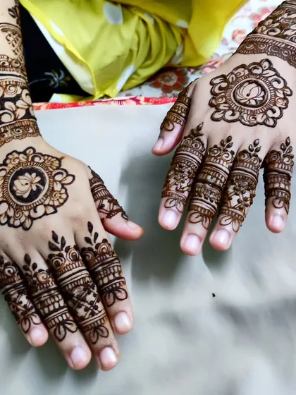 The matching hand design for the lotus cutwork, showing how to create a cohesive set.
