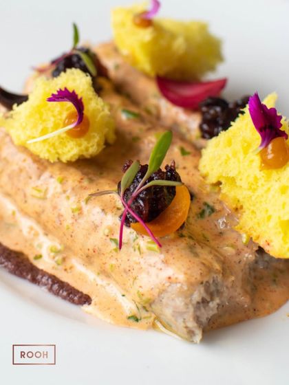 Detail shot of the Chicken Seekh Kebab, highlighting the different components that come together to create a multi-layered tasting experience.