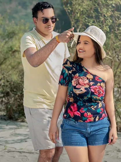 A cute, playful moment with a hat. These are the small, unscripted interactions that I love to capture, as they show the genuine connection and fun between a couple.