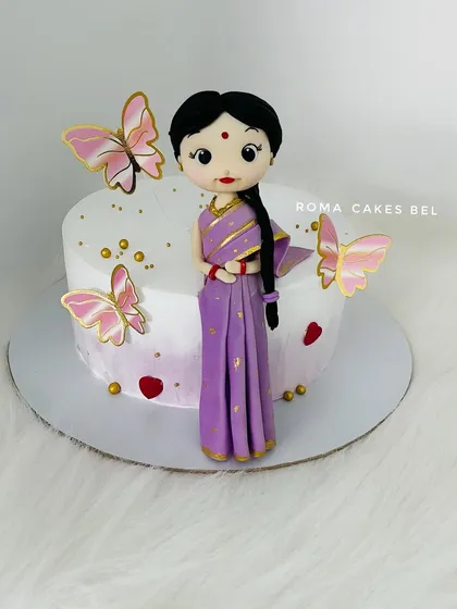 Another view of the beautiful saree-clad figurine, showing the delicate gold details on her dress.
