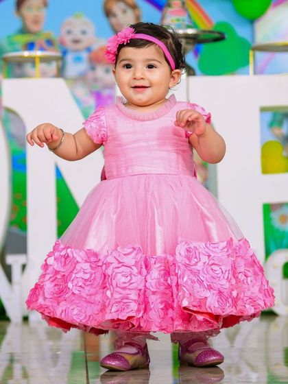 A charming 'Baby Boss' themed birthday party, with a sophisticated black and white color scheme, custom props, and a stylish backdrop, perfect for a little executive.