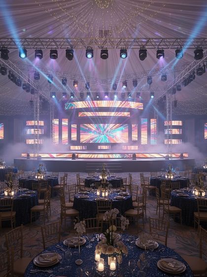 This 3D render shows a Sangeet stage integrated with guest seating. The design uses multiple LED screens and a tented ceiling with professional lighting to create a cohesive and spectacular event space.
