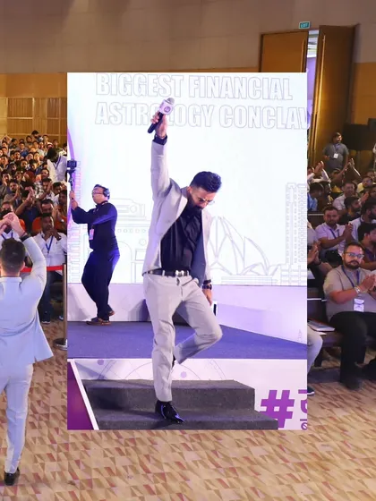A high-energy moment on stage, celebrating a successful session at the conclave.