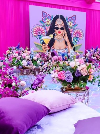 A closer look at the seating and floral details for the pop-art Mehendi. The low seating arrangement encourages a relaxed and social atmosphere for the guests.