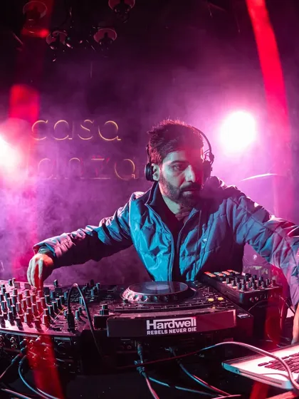 A close-up shot from a gig at Casa Danza, with the purple and pink lights creating a cool, moody atmosphere.