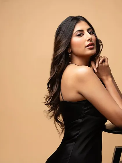 The oomph. A simple, elegant portrait of actress Shweta Avasthi against a neutral background, where the focus is entirely on her presence and expression.