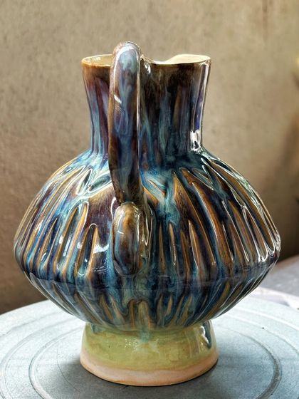 Another angle of my favorite pitcher, highlighting the shape of the handle and the drips of glaze. These little imperfections are what make each handmade piece truly unique and full of character.