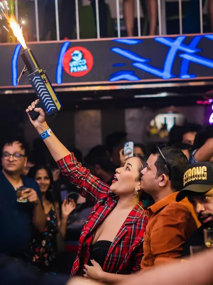 A guest firing a confetti gun into the crowd. I love getting the partygoers involved, making them part of the show and creating an interactive, high-energy nightlife experience.
