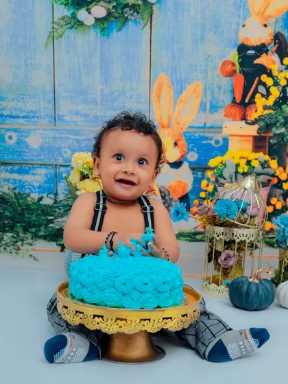 Nothing says "Happy First Birthday" like a cake smash! We love capturing the pure joy and delightful mess as your little one dives into their first cake. This is a memory full of laughter.