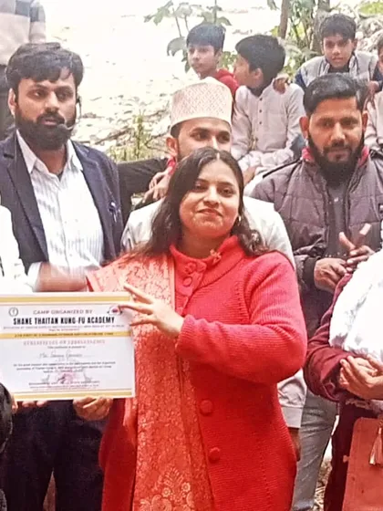 Presenting a certificate of appreciation during one of our outdoor training camps. We recognize not just the students, but also those who support our community.