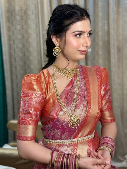 A side profile shot, highlighting her beautiful features and the intricate details of her hairstyle.