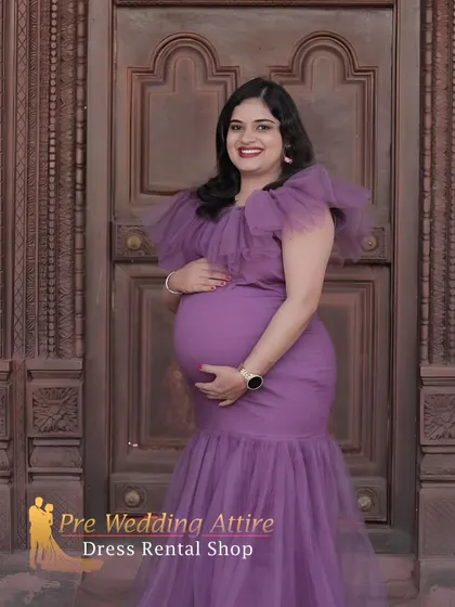 This indoor portrait shows the versatility of the purple mermaid gown. The rich color and elegant silhouette look just as stunning in a more formal setting against a classic wooden door.