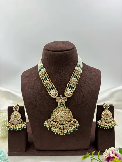 I love the timeless elegance of antique gold finish jewellery. This long necklace set, with its detailed pendant and pearl bead strings, offers a classic, heritage look perfect for traditional ceremonies and events.