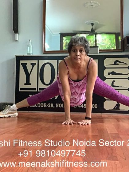 A wide-legged squat, or Prasarita Squat, which targets the inner thighs and improves hip flexibility.