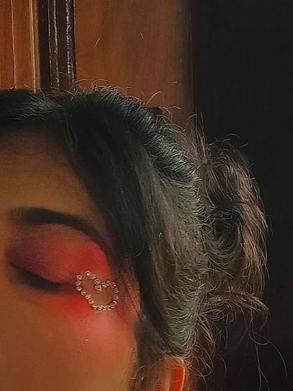 A close-up detail of the rhinestone heart. This kind of intricate makeup work is something I love doing for conceptual shoots or for clients who want a truly unique party look.