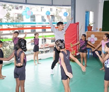 Tots N Teens - Kids Recreational Gymnastics Our Awesome Coaches in Action photo 3