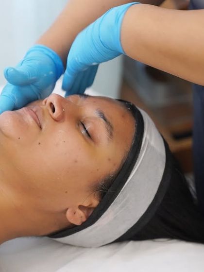A close-up of a client in a state of pure relaxation during a facial massage. My goal is to create a moment of true calm while delivering effective skincare.