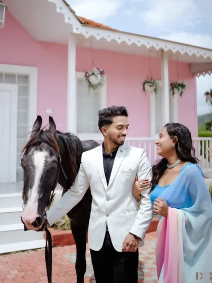 For couples who dream of a fairytale, I bring those visions to life. Incorporating elements like a beautiful horse against a whimsical pink house creates a truly unforgettable and magical pre-wedding photo.
