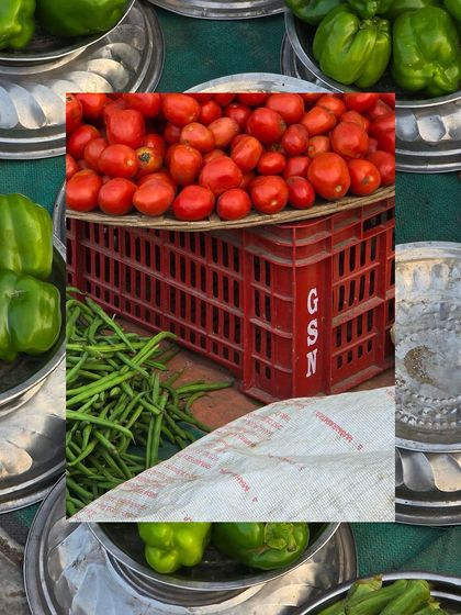 A collage of red and green produce, with a crate of tomatoes framed by plates of green capsicums.