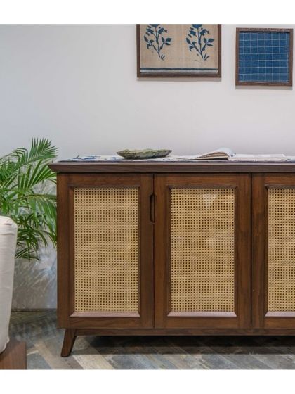 This wood and rattan sideboard embodies the legacy of Indian craftsmanship. The intricate weave and clean lines translate centuries-old techniques into a design that is both timeless and functional for modern interiors.