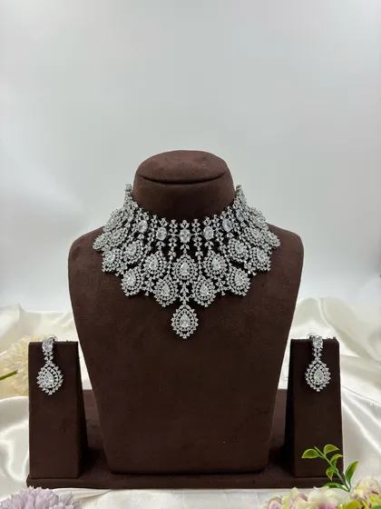 The all-white version of the dense, layered AD necklace.