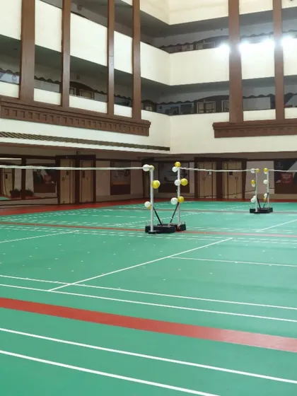 A straight-on view of our courts, highlighting the clear markings and professional nets. This is a space built for serious badminton players.