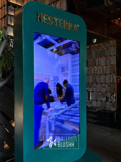 A custom digital photo booth kiosk designed for the Nesterra event, allowing guests to capture and share moments from the immersive brand experience.