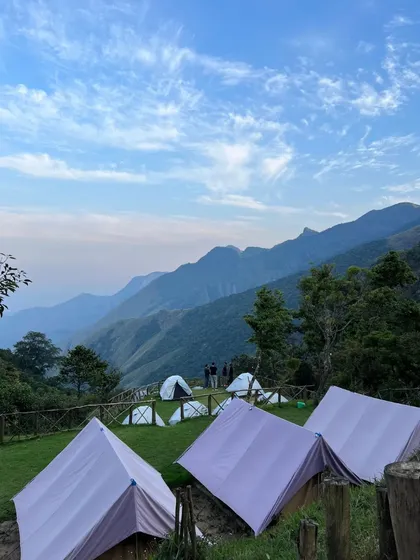 A wide view of the Munnar campsite on a clear day.