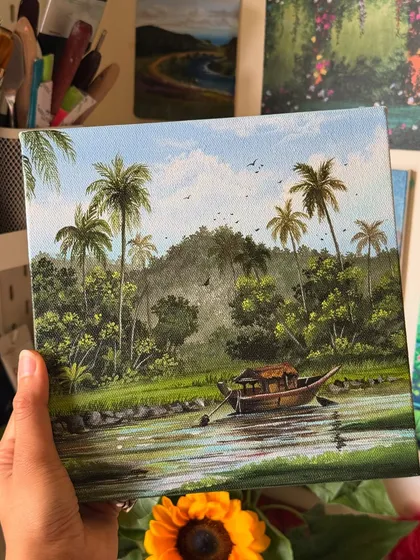 I painted this serene scene of the Kerala backwaters, capturing a traditional houseboat floating on the calm water surrounded by lush palm trees. This tranquil landscape artwork brings the peace of "God's own country" to life.