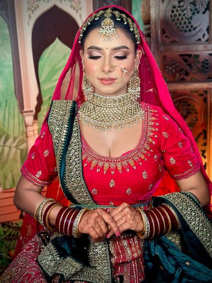 The bride with her dupatta set. The makeup is designed to look stunning even with the head covered.