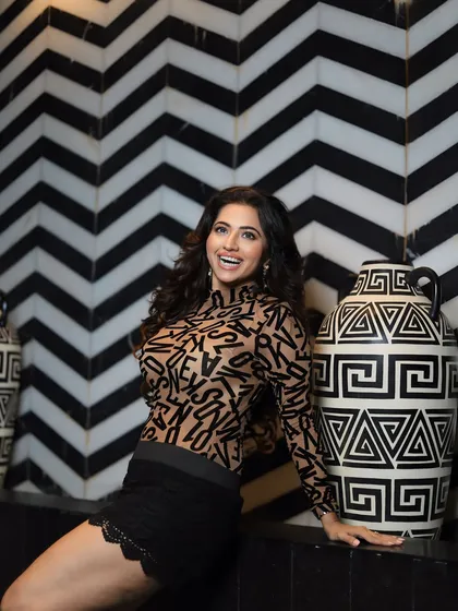 A happy, smiling shot that shows how the makeup looks natural and radiant even with a full smile.