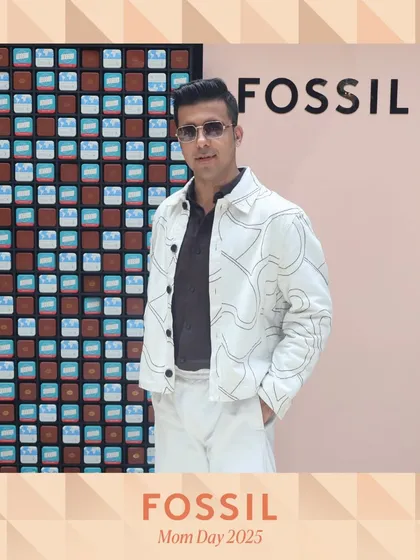 A guest showing off his unique style at the Fossil event. The high-quality images capture every detail of the fashion on display.